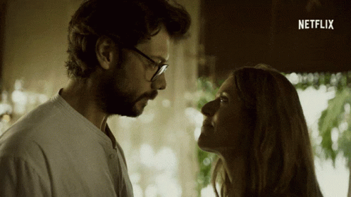 A Man And A Woman Are Looking At Each Other With A Netflix Logo In The Corner GIF