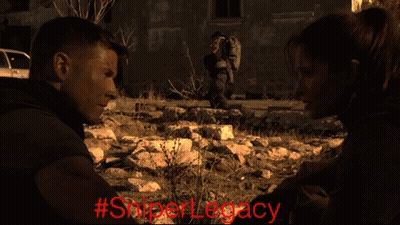 A Man And A Woman Are Looking At Each Other With The Hashtag #Sniperlegacy GIF