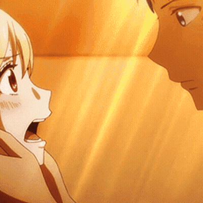 A Man And A Woman Are Looking At Each Other With The Woman Looking Surprised GIF