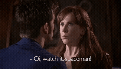 A Man And A Woman Are Looking At Each Other With The Words Oi Watch It Spaceman GIF