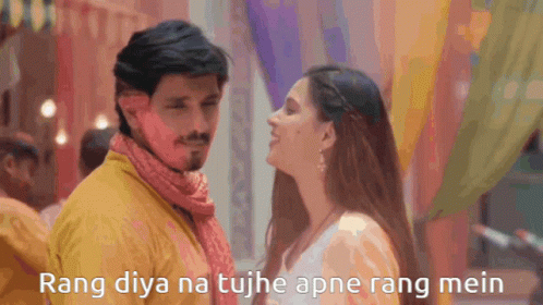 A Man And A Woman Are Looking At Each Other With The Words Rang Diya Na Tujh Apne Rang Mein Above Them GIF