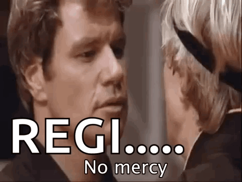 A Man And A Woman Are Looking At Each Other With The Words Regi No Mercy Written On The Screen . GIF