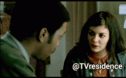 A Man And A Woman Are Looking At Each Other With The Words @Tvresidence Below Them GIF