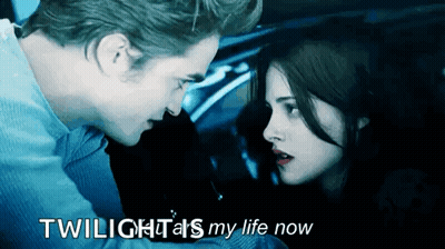 A Man And A Woman Are Looking At Each Other With The Words Twilight 'S My Life Now GIF