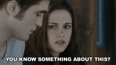 A Man And A Woman Are Looking At Each Other With The Words " You Know Something About This " Below Them GIF