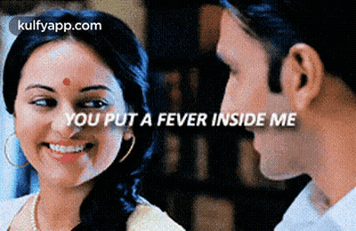 A Man And A Woman Are Looking At Each Other With The Words You Put A Fever Inside Me GIF