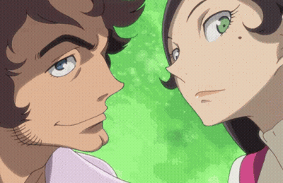 A Man And A Woman Are Looking At Each Other With Their Eyes Closed GIF