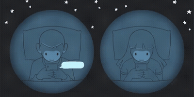 A Man And A Woman Are Looking At Their Phones GIF