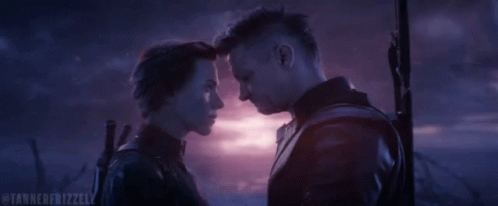 A Man And A Woman Are Looking Into Each Other 'S Eyes And The Caption Says Tannererizzell GIF