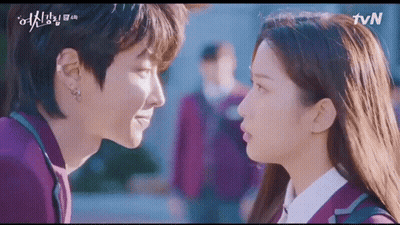 A Man And A Woman Are Looking Into Each Other 'S Eyes In A Korean Drama . GIF