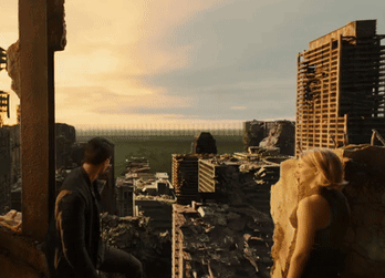 A Man And A Woman Are Looking Out Over A Ruined City GIF