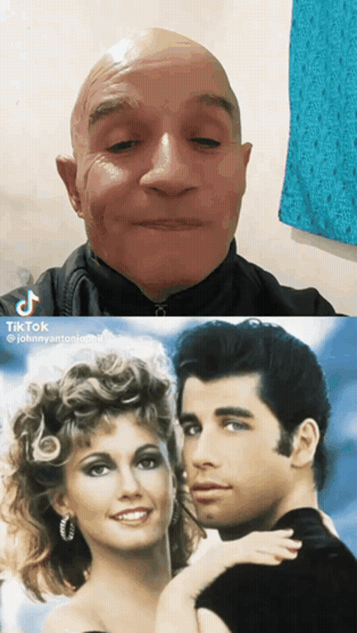 A Man And A Woman Are Next To Each Other GIF