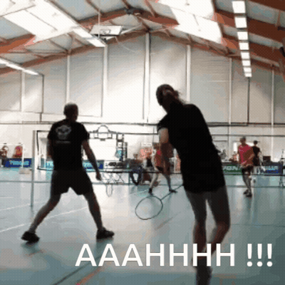 A Man And A Woman Are Playing Badminton In A Gym And The Caption Says Aaahhhh !!! GIF
