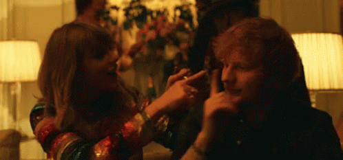 A Man And A Woman Are Playing With Each Other In A Living Room . GIF