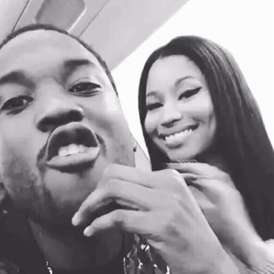 A Man And A Woman Are Posing For A Picture Together And Smiling In A Black And White Photo . GIF
