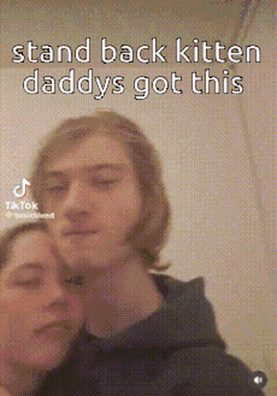 A Man And A Woman Are Posing For A Picture With A Caption That Says `` Stand Back Kitten Daddys Got This '' GIF