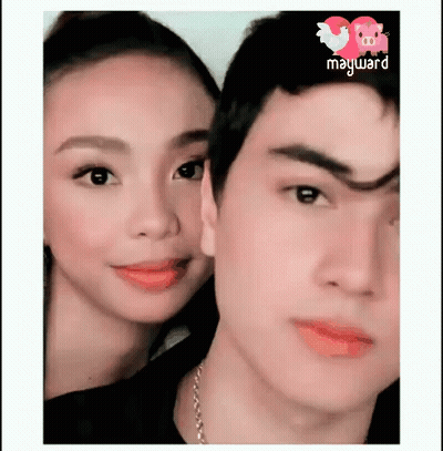 A Man And A Woman Are Posing For A Picture With The Word Mayward On The Bottom GIF