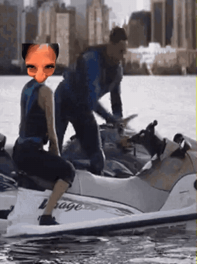 A Man And A Woman Are Riding A Jet Ski With The Word Rage On It GIF