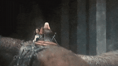 A Man And A Woman Are Riding On The Back Of A Horse . GIF