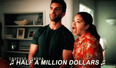 A Man And A Woman Are Singing Half A Million Dollars In A Room GIF