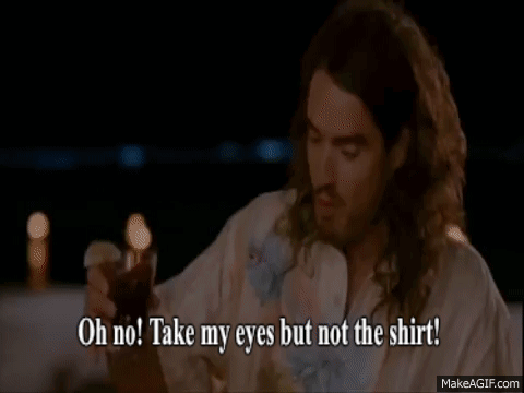 A Man And A Woman Are Sitting At A Table And The Woman Is Saying Oh No Take My Eyes But Not The Shirt GIF