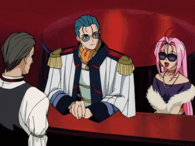 A Man And A Woman Are Sitting At A Table In A Cartoon Scene GIF