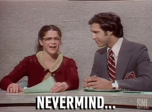 A Man And A Woman Are Sitting At A Table Talking To Each Other And The Woman Is Saying `` Nevermind '' . GIF