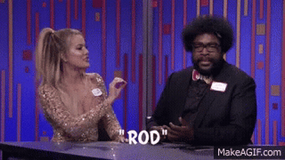A Man And A Woman Are Sitting At A Table With The Word Rod Written On The Table GIF