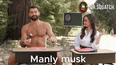 A Man And A Woman Are Sitting At Desks With The Words Manly Musk On The Bottom GIF