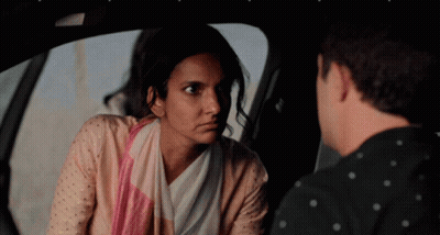 A Man And A Woman Are Sitting In A Car GIF