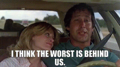 A Man And A Woman Are Sitting In A Car With The Words `` I Think The Worst Is Behind Us '' GIF