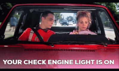 A Man And A Woman Are Sitting In A Car With The Words " Your Check Engine Light Is On " Below Them GIF