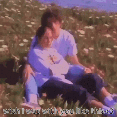 A Man And A Woman Are Sitting In A Field With The Words Wish I Was With You Like This 3 GIF