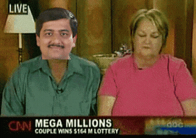 A Man And A Woman Are Sitting In Front Of A Mega Millions Lottery Advertisement GIF