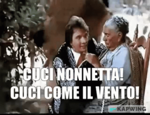A Man And A Woman Are Sitting Next To Each Other And The Woman Is Holding The Man 'S Hand . GIF