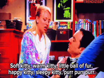 A Man And A Woman Are Sitting Next To Each Other And The Woman Is Saying Soft Kitty GIF