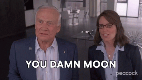 A Man And A Woman Are Sitting Next To Each Other And The Woman Is Saying You Damn Moon GIF