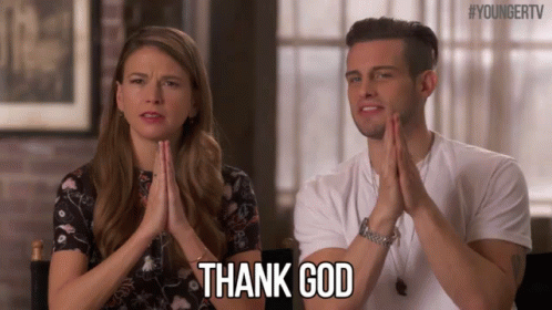 A Man And A Woman Are Sitting Next To Each Other With Their Hands Folded And The Man Is Saying Thank God GIF