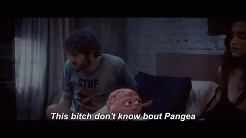 A Man And A Woman Are Sitting On A Bed And The Man Is Talking To The Woman . GIF
