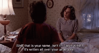 A Man And A Woman Are Sitting On A Bed And The Woman Says Well That Is Your Name Isn't It Calvin Klein GIF