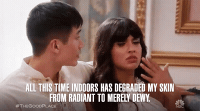 A Man And A Woman Are Sitting On A Couch And The Man Says All This Time Indoors Has Degraded My Skin From Radiant GIF