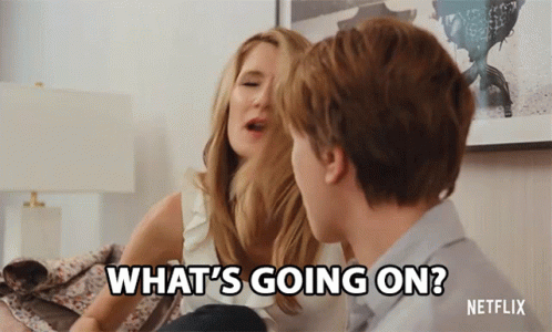 A Man And A Woman Are Sitting On A Couch And The Woman Says What 'S Going On GIF