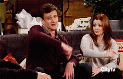 A Man And A Woman Are Sitting On A Couch With Citytv Written On The Bottom GIF