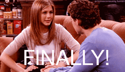 A Man And A Woman Are Sitting On A Couch With The Words Finally Written On The Bottom GIF