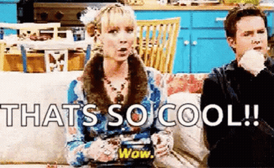 A Man And A Woman Are Sitting On A Couch With The Words `` That 'S So Cool '' Written On The Screen . GIF