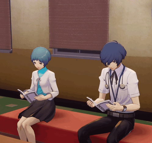A Man And A Woman Are Sitting On A Red Couch Reading Books GIF