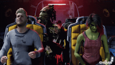 A Man And A Woman Are Sitting On A Roller Coaster With Guardians Of The Galaxy In The Background GIF