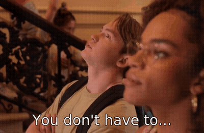A Man And A Woman Are Sitting On A Set Of Stairs And The Man Says " You Don 'T Have To " GIF