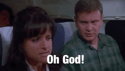A Man And A Woman Are Sitting On An Airplane . GIF