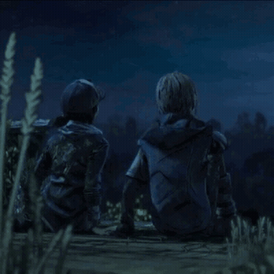 A Man And A Woman Are Sitting On The Ground Looking At The Night Sky . GIF